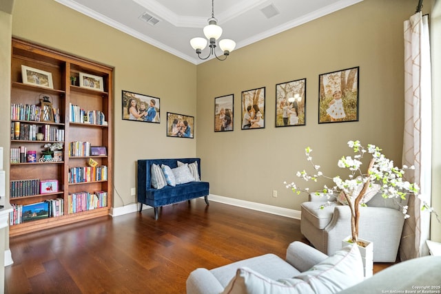 sitting room featuring dark wood-style flooring, crown molding, visible vents, an inviting chandelier, and baseboards