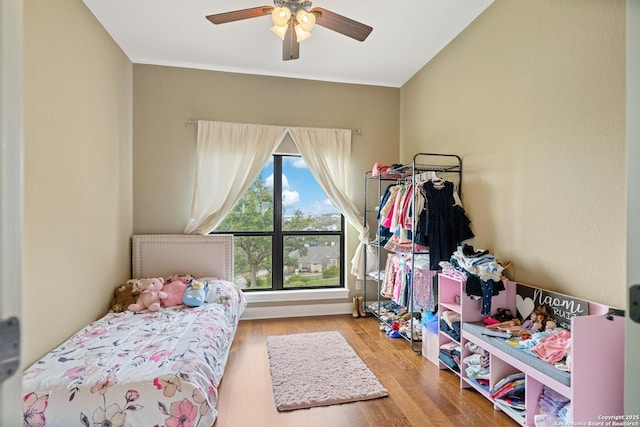 bedroom with light wood finished floors and ceiling fan