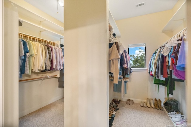 spacious closet featuring light carpet and visible vents