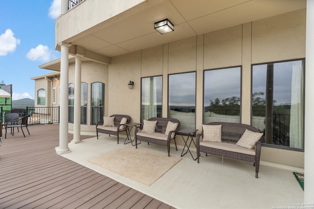 wooden deck with outdoor lounge area