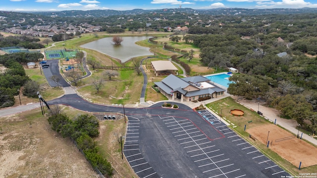 birds eye view of property with a water view