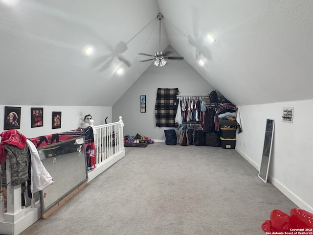 recreation room with baseboards, a ceiling fan, lofted ceiling, and carpet floors
