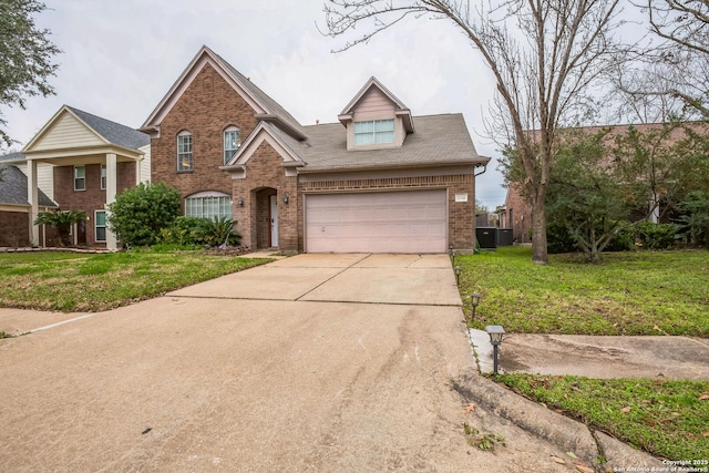 traditional home with a front yard, concrete driveway, brick siding, and an attached garage