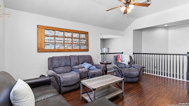 living area featuring lofted ceiling, ceiling fan, and dark wood-type flooring