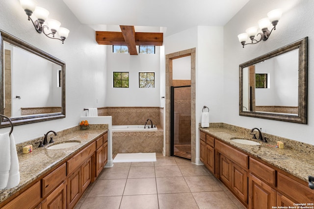 full bathroom with a garden tub, a stall shower, a sink, and tile patterned floors