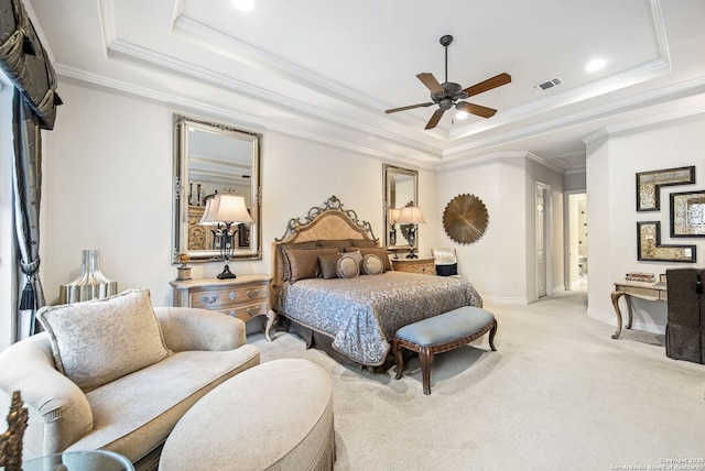 bedroom featuring a raised ceiling, visible vents, light carpet, and baseboards