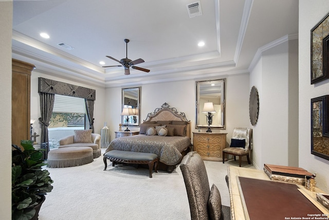 bedroom with crown molding, a raised ceiling, visible vents, and light colored carpet