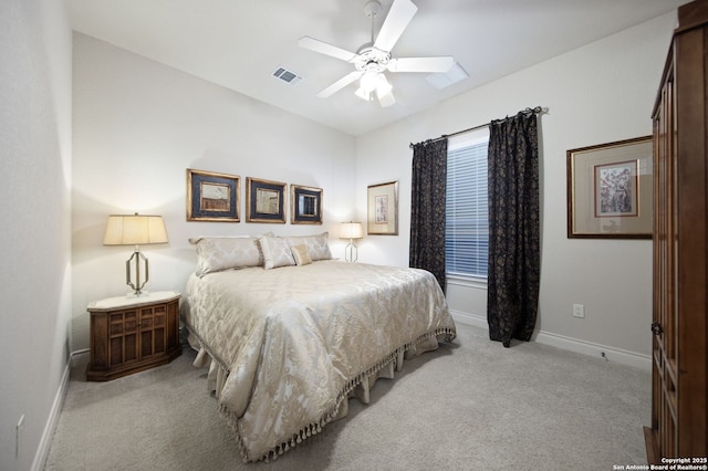 bedroom featuring visible vents, ceiling fan, light carpet, and baseboards