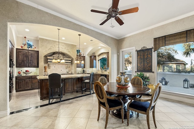 dining area with recessed lighting, ceiling fan with notable chandelier, ornamental molding, and light tile patterned flooring