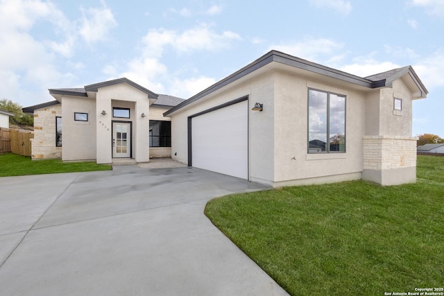 view of front facade with an attached garage, driveway, stone siding, stucco siding, and a front yard