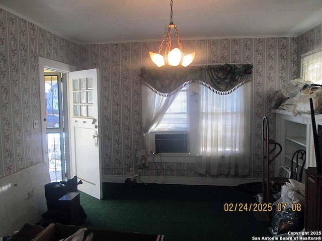 interior details with carpet flooring, a notable chandelier, and wallpapered walls