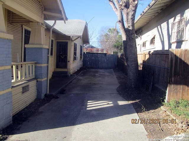 view of home's exterior with fence