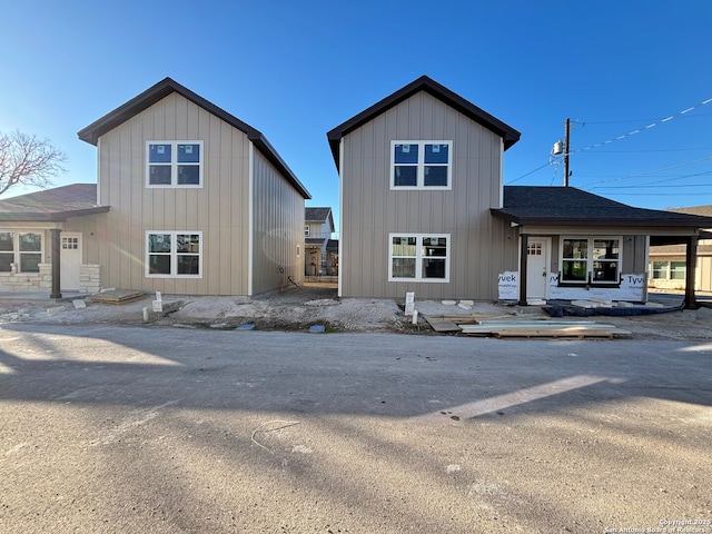 view of front of home featuring a shingled roof