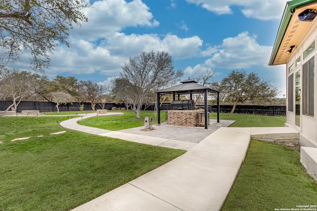 view of property's community featuring a fenced backyard, a yard, a gazebo, and a patio