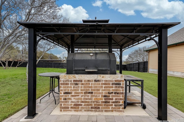 view of patio with a gazebo, fence, outdoor dry bar, and area for grilling