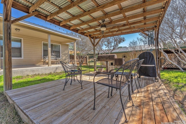 wooden deck featuring fence and a ceiling fan