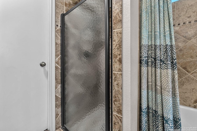 bathroom with tiled shower