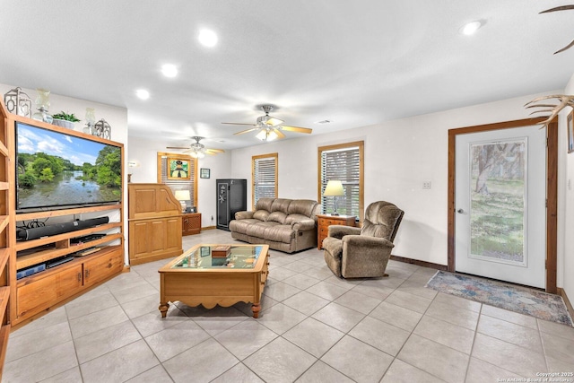 living area with light tile patterned floors, baseboards, and recessed lighting