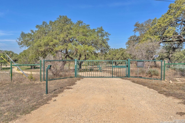 view of gate featuring fence