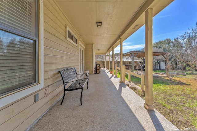 view of patio / terrace featuring fence