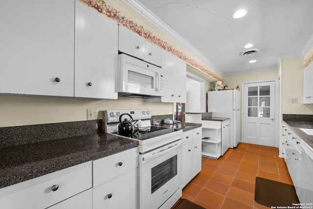 kitchen featuring ornamental molding, white appliances, visible vents, and white cabinets