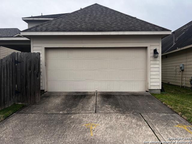 garage with fence