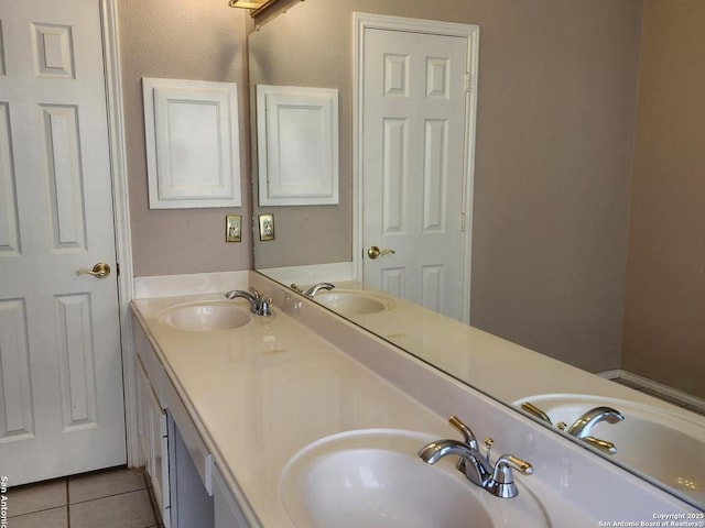 full bathroom featuring double vanity, a sink, and tile patterned floors