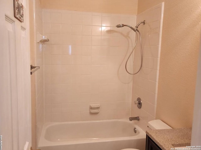 bathroom featuring shower / bath combination, vanity, and toilet