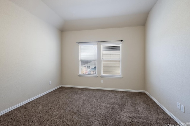 empty room with carpet and baseboards