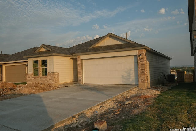 8421 Roadrunner Psge, San Antonio, TX 78222 - ranch-style house with brick siding, a garage, driveway, and central AC
