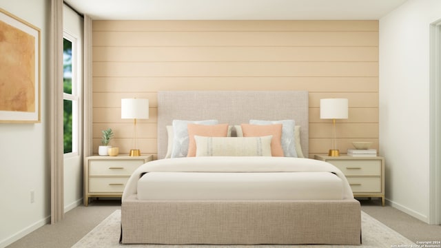 bedroom with baseboards and light colored carpet