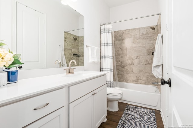 full bath featuring toilet, shower / bathtub combination with curtain, wood finished floors, and vanity