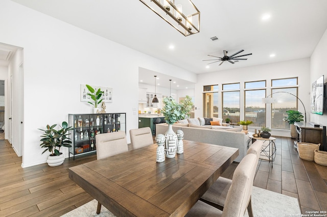 dining area featuring dark wood-style floors, ceiling fan, visible vents, and recessed lighting