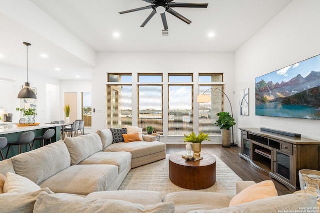 living room with recessed lighting, wood finished floors, visible vents, and a healthy amount of sunlight