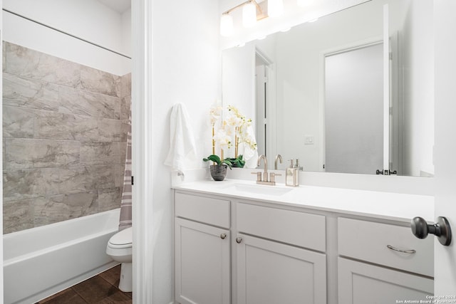 bathroom featuring shower / bath combo, vanity, and toilet