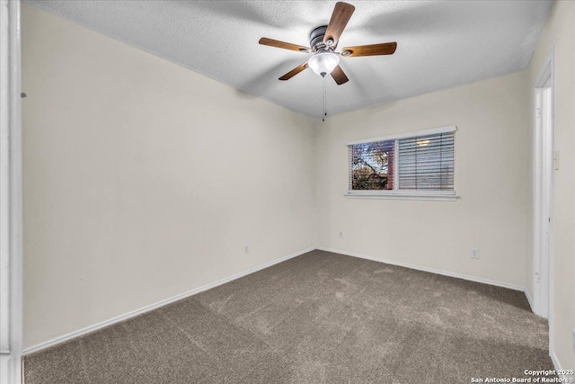 empty room with carpet floors, a textured ceiling, baseboards, and a ceiling fan