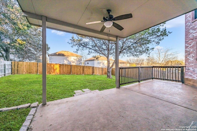 view of patio featuring ceiling fan and a fenced backyard