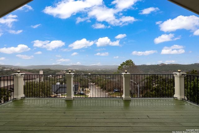 wooden deck with a mountain view