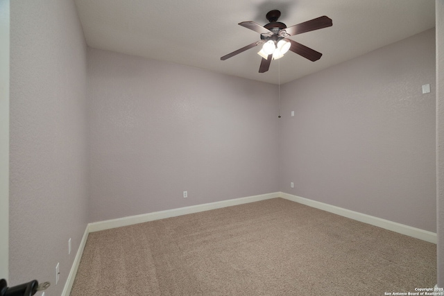 empty room featuring carpet flooring, ceiling fan, and baseboards