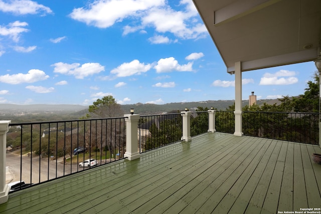 wooden deck with a mountain view