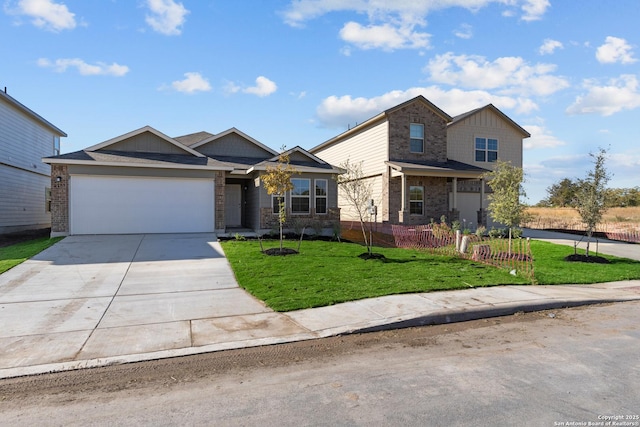 view of front facade with an attached garage, concrete driveway, brick siding, and a front yard