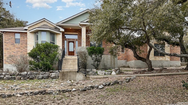 view of front of house featuring brick siding