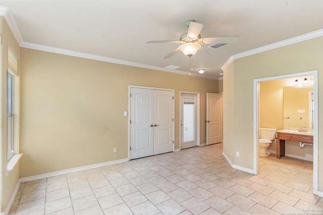 unfurnished bedroom with light tile patterned flooring, connected bathroom, visible vents, baseboards, and crown molding