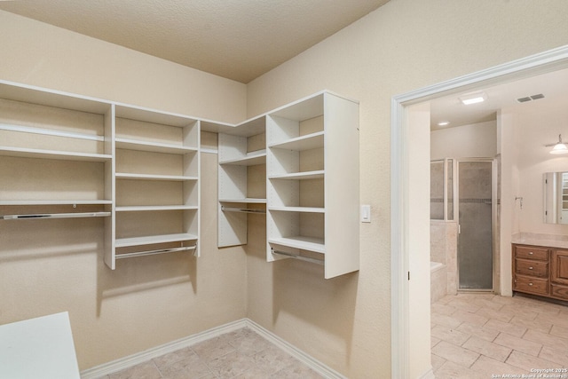 walk in closet with visible vents