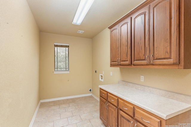 kitchen with brown cabinetry and light countertops