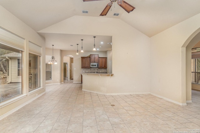 unfurnished living room featuring arched walkways, visible vents, lofted ceiling, and ceiling fan with notable chandelier