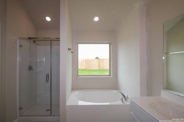 10314 Tule Creek Frk, San Antonio, TX 78252 - bathroom with vanity, a stall shower, a bath, and recessed lighting