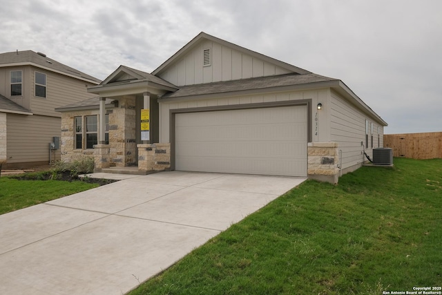 10314 Tule Creek Frk, San Antonio, TX 78252 - view of front of home featuring board and batten siding, a front lawn, driveway, an attached garage, and a shingled roof