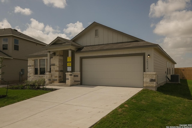 10314 Tule Creek Frk, San Antonio, TX 78252 - craftsman-style house featuring board and batten siding, driveway, a garage, stone siding, and a shingled roof