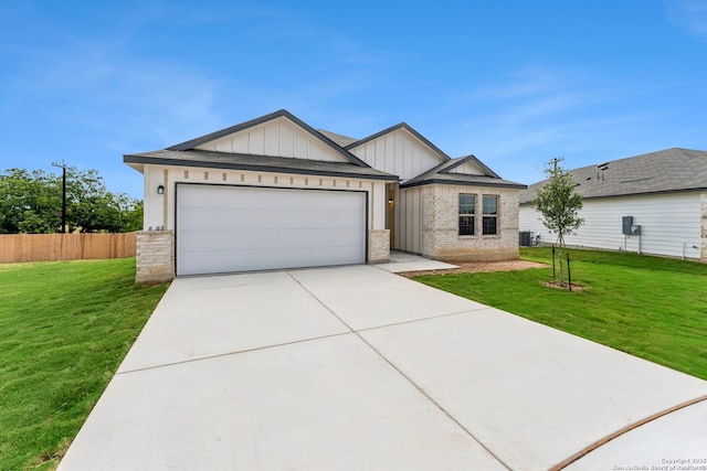 10314 Tule Creek Frk, San Antonio, TX 78252 - view of front of property featuring board and batten siding, an attached garage, brick siding, and driveway